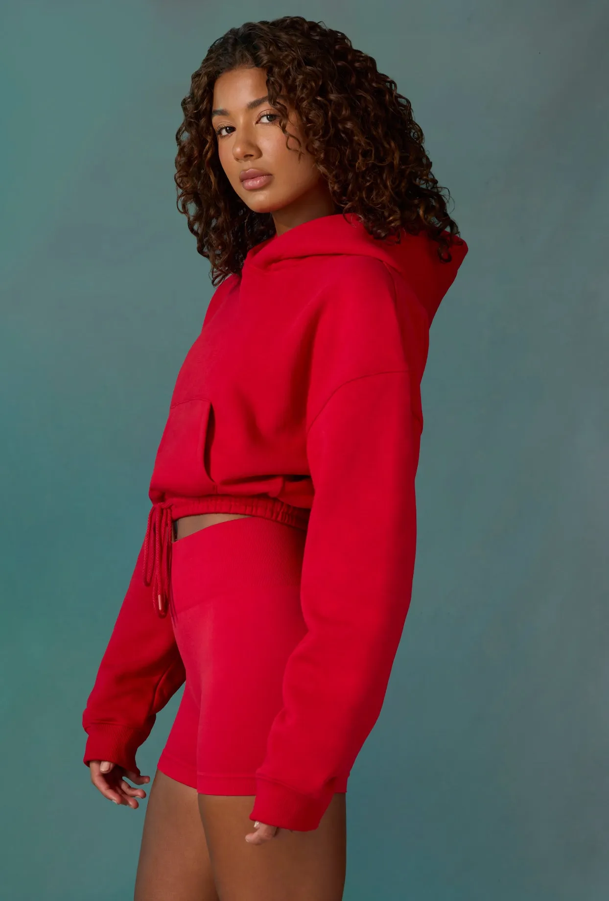 Cropped Drawstring Hooded Sweatshirt in Tango Red