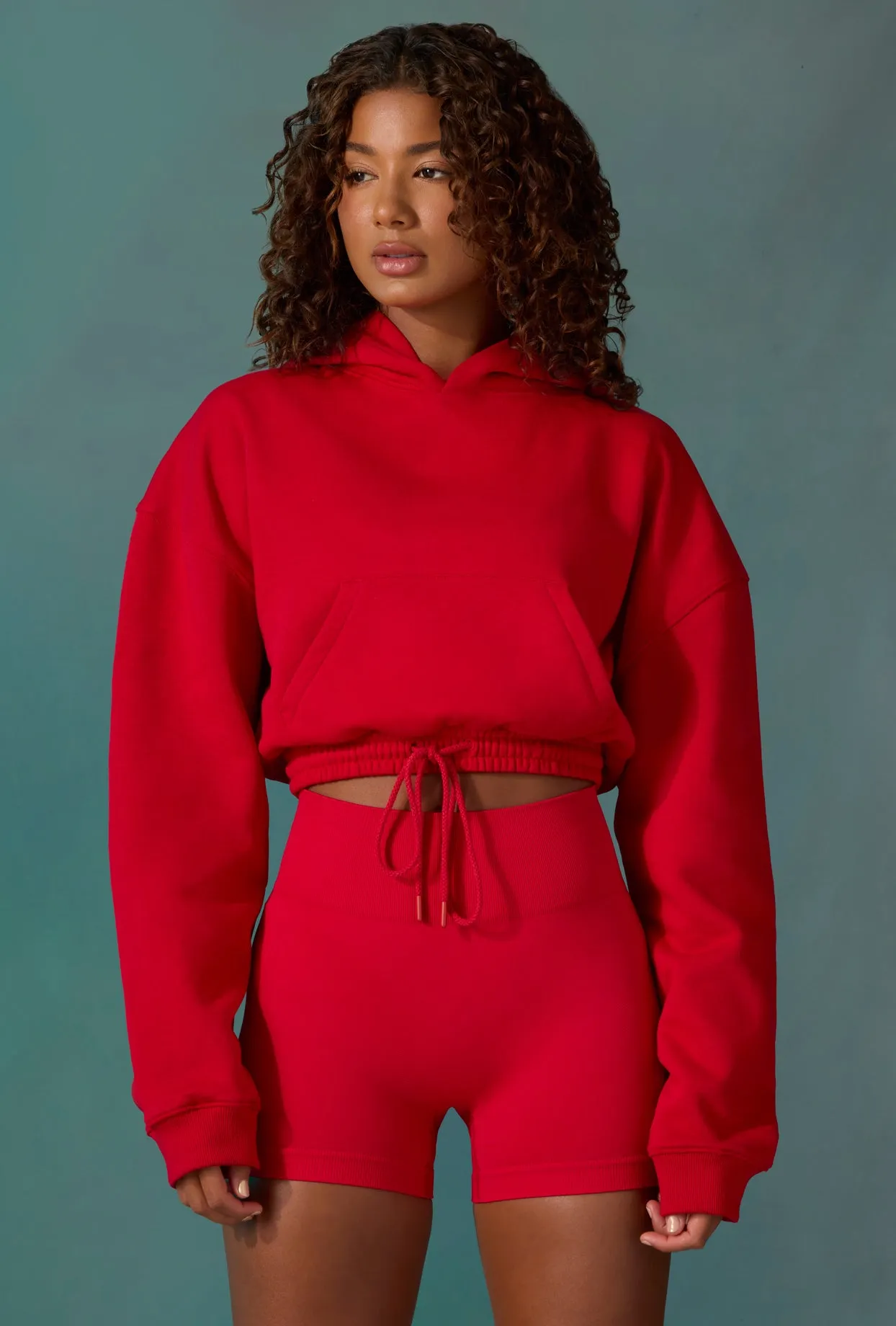 Cropped Drawstring Hooded Sweatshirt in Tango Red