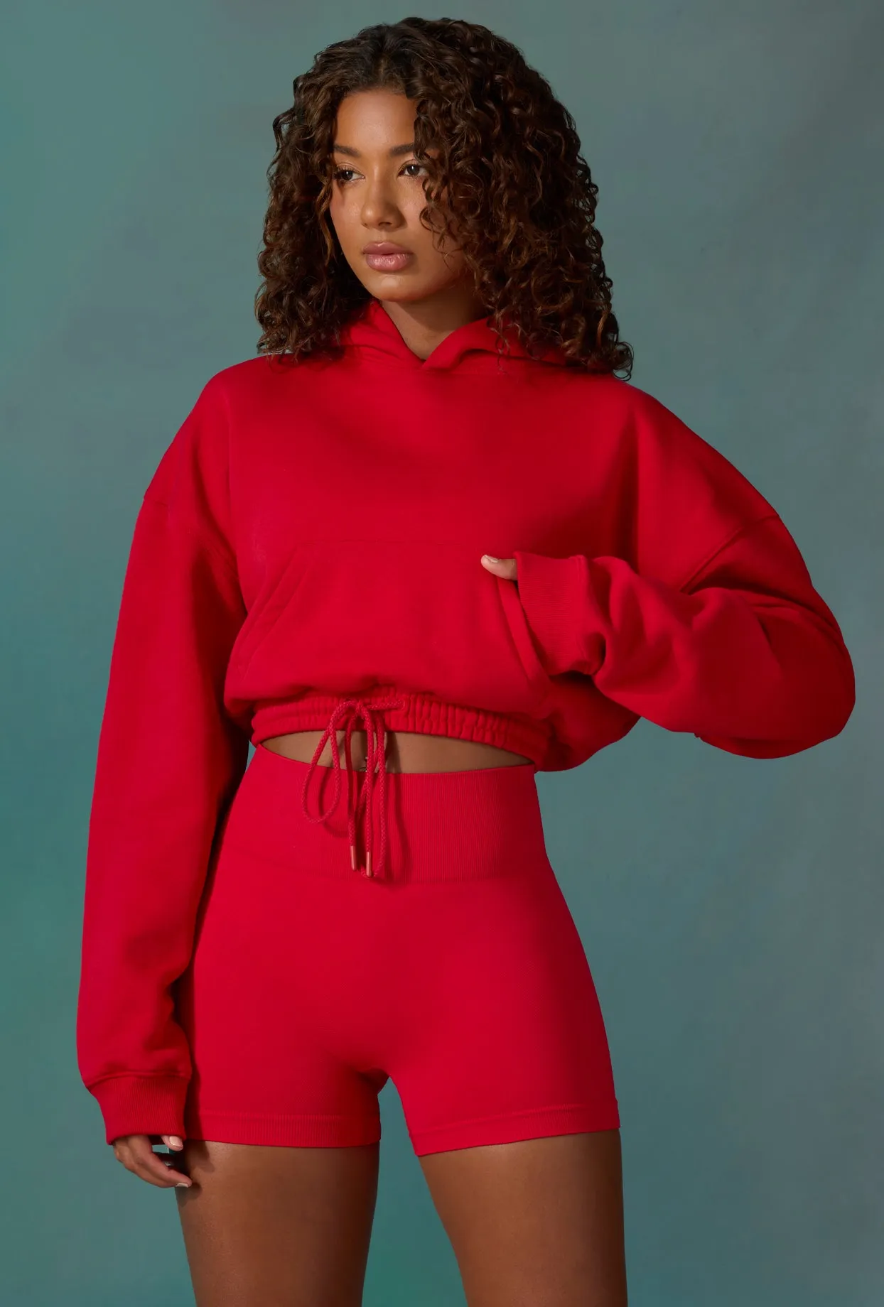 Cropped Drawstring Hooded Sweatshirt in Tango Red